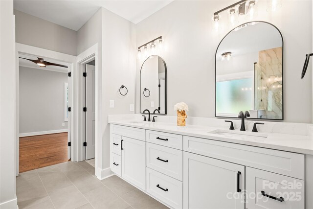 1004 E Sandy Ridge Rd, Monroe, NC 28112 - full bathroom with double vanity and tile patterned floors