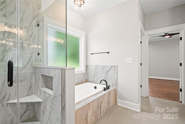 1004 E Sandy Ridge Rd, Monroe, NC 28112 - bathroom featuring tile patterned floors, a garden tub, and a marble finish shower