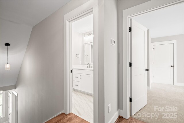 1004 E Sandy Ridge Rd, Monroe, NC 28112 - corridor featuring baseboards and light wood-type flooring