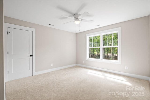 1004 E Sandy Ridge Rd, Monroe, NC 28112 - unfurnished room featuring carpet floors and ceiling fan