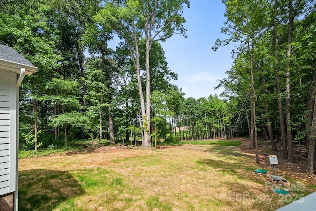 1004 E Sandy Ridge Rd, Monroe, NC 28112 - view of green lawn with a forest view