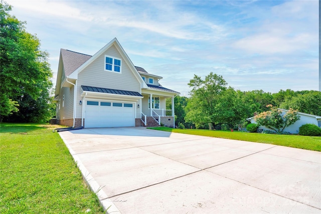 102 Starmount Dr, Kings Mountain, NC 28086 - traditional home featuring covered porch, concrete driveway, a standing seam roof, a front lawn, and a garage