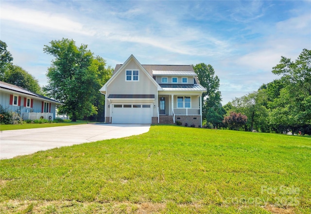 102 Starmount Dr, Kings Mountain, NC 28086 - view of front of house with concrete driveway, a porch, a front lawn, and metal roof