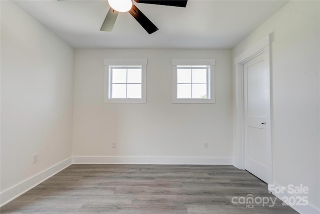 102 Starmount Dr, Kings Mountain, NC 28086 - empty room featuring plenty of natural light, ceiling fan, wood finished floors, and baseboards