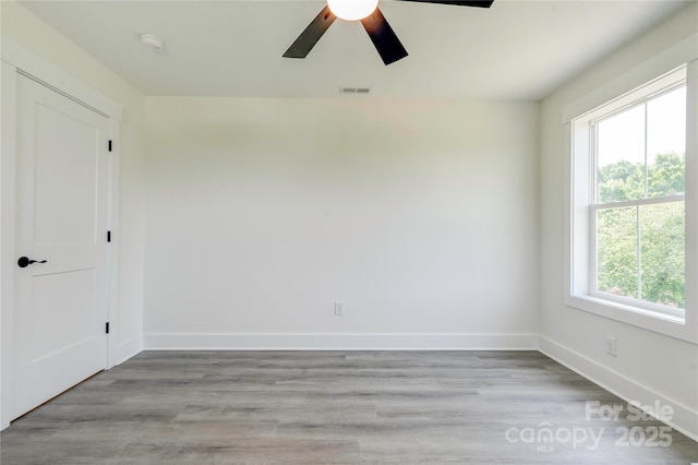 102 Starmount Dr, Kings Mountain, NC 28086 - unfurnished room with a ceiling fan, baseboards, a smoke detector, and light wood-style floors