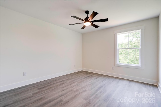 102 Starmount Dr, Kings Mountain, NC 28086 - unfurnished room with wood finished floors, baseboards, and ceiling fan