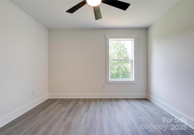 102 Starmount Dr, Kings Mountain, NC 28086 - spare room with wood finished floors, a ceiling fan, and baseboards