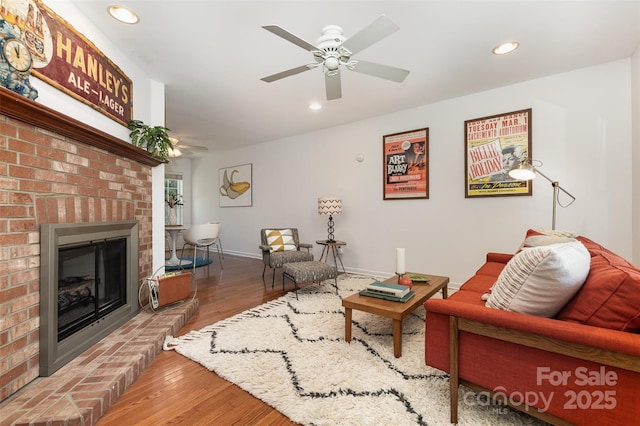1912 Baxter St, Charlotte, NC 28204 - living room with a brick fireplace, wood finished floors, recessed lighting, and ceiling fan