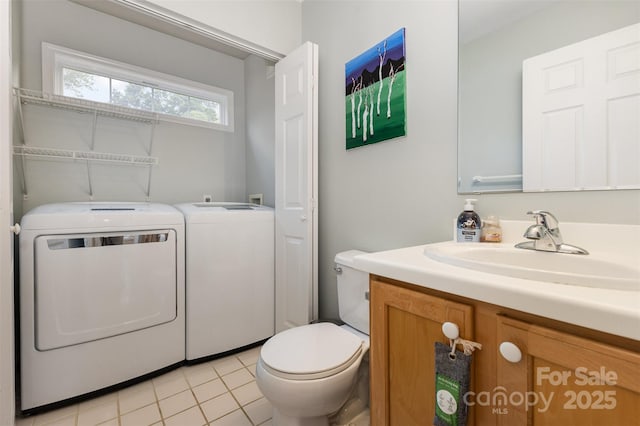 1912 Baxter St, Charlotte, NC 28204 - bathroom featuring washing machine and dryer, vanity, and tile patterned floors