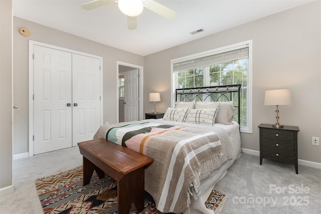 1912 Baxter St, Charlotte, NC 28204 - bedroom with light colored carpet, a closet, and a ceiling fan