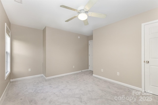 1912 Baxter St, Charlotte, NC 28204 - unfurnished bedroom with light colored carpet and a ceiling fan