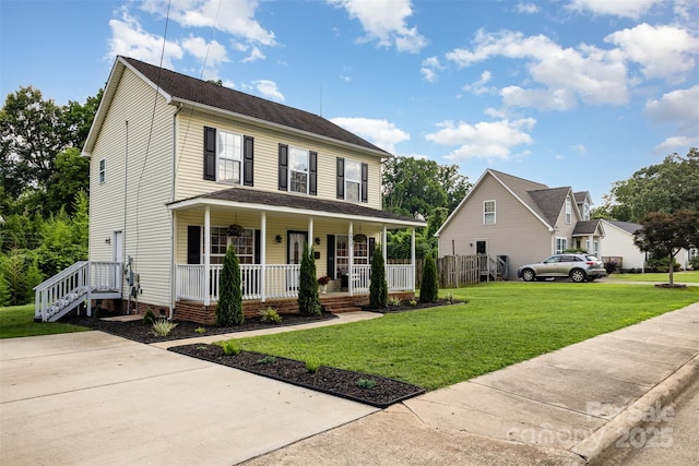 1912 Baxter St, Charlotte, NC 28204 - colonial home featuring a porch and a front lawn