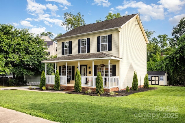1912 Baxter St, Charlotte, NC 28204 - colonial house featuring a storage unit, covered porch, and a front yard