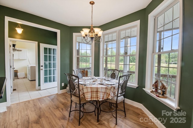 30 Linn Garden Ln, Swannanoa, NC 28778 - dining room with a chandelier, healthy amount of natural light, and wood finished floors