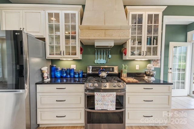 30 Linn Garden Ln, Swannanoa, NC 28778 - kitchen with appliances with stainless steel finishes, custom exhaust hood, and glass insert cabinets