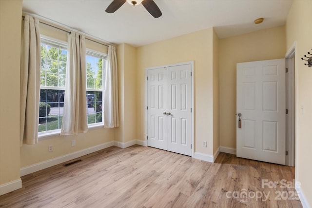 30 Linn Garden Ln, Swannanoa, NC 28778 - unfurnished bedroom featuring wood finished floors, a closet, and ceiling fan