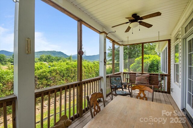 30 Linn Garden Ln, Swannanoa, NC 28778 - sunroom featuring a mountain view, ceiling fan, an outdoor hangout area, and plenty of natural light