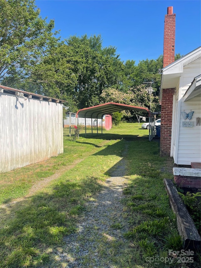 408 Moose St, Albemarle, NC 28001 - view of grassy yard with a detached carport
