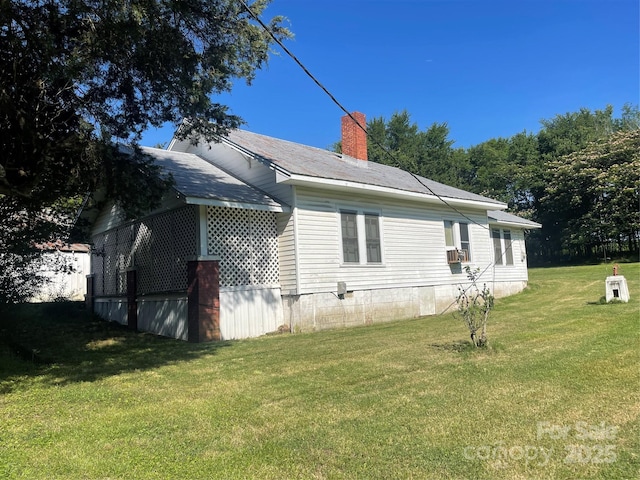 408 Moose St, Albemarle, NC 28001 - view of side of home featuring a lawn and a chimney
