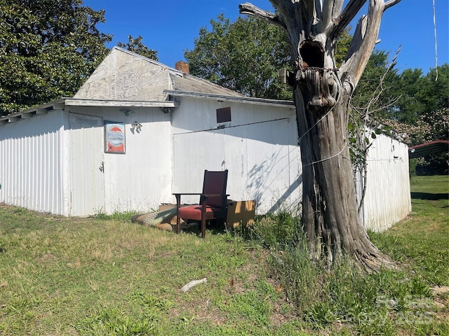 408 Moose St, Albemarle, NC 28001 - view of side of home with a lawn and a chimney