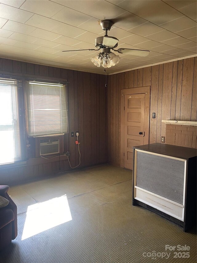 408 Moose St, Albemarle, NC 28001 - unfurnished room featuring wood walls, ceiling fan, and cooling unit