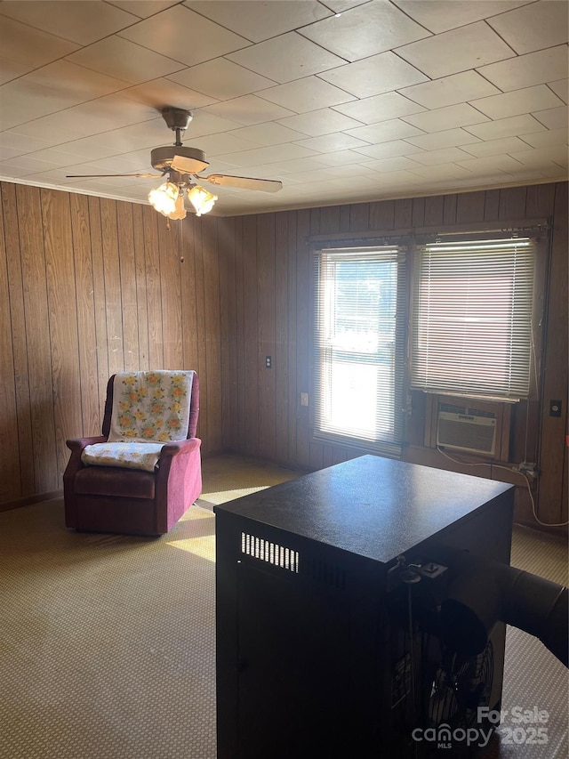 408 Moose St, Albemarle, NC 28001 - interior space featuring cooling unit, wood walls, ceiling fan, and carpet flooring