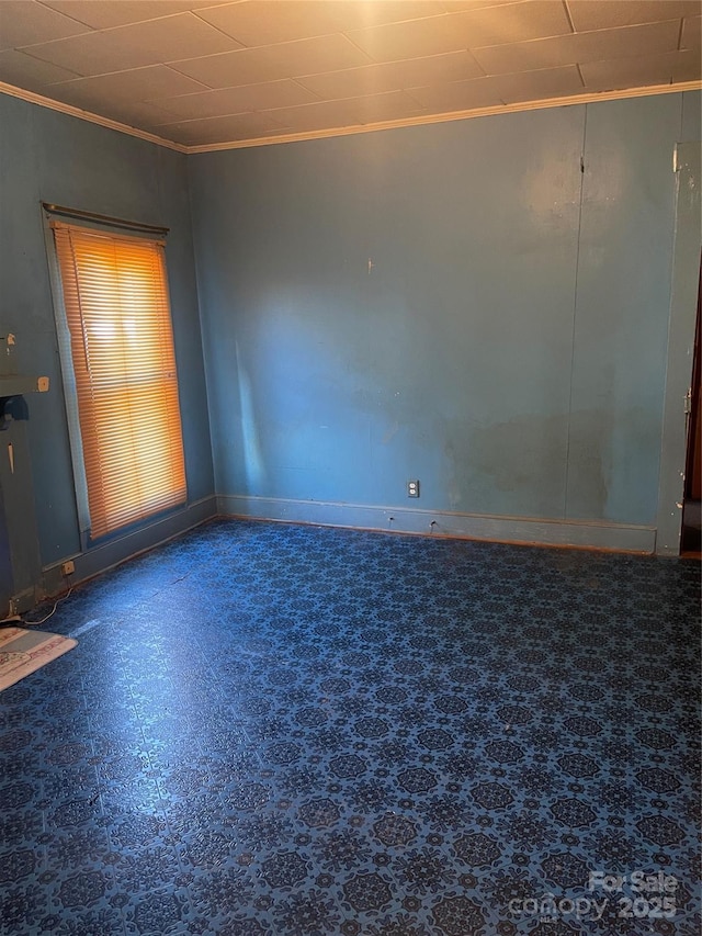 408 Moose St, Albemarle, NC 28001 - spare room featuring crown molding, baseboards, and tile patterned floors