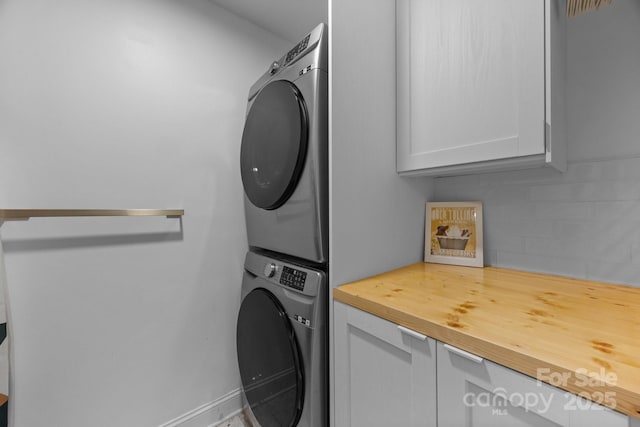 415 N Church St Unit 311, Charlotte, NC 28202 - laundry room with estacked washer and dryer and cabinet space