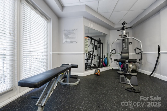 415 N Church St Unit 311, Charlotte, NC 28202 - exercise area featuring baseboards and a paneled ceiling