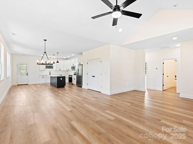 169 Vineyard Village Dr S Unit 4, Old Fort, NC 28762 - unfurnished living room with a chandelier, recessed lighting, ceiling fan, light wood-type flooring, and high vaulted ceiling