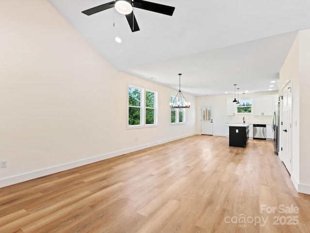 169 Vineyard Village Dr S Unit 4, Old Fort, NC 28762 - unfurnished living room with a ceiling fan, recessed lighting, light wood finished floors, and a chandelier