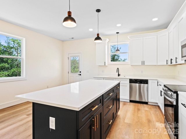169 Vineyard Village Dr S Unit 4, Old Fort, NC 28762 - kitchen featuring appliances with stainless steel finishes, healthy amount of natural light, light wood-style flooring, and recessed lighting