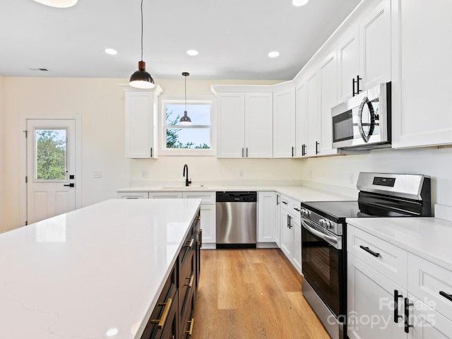169 Vineyard Village Dr S Unit 4, Old Fort, NC 28762 - kitchen featuring appliances with stainless steel finishes, light wood-style floors, white cabinets, and recessed lighting