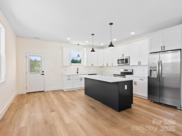 169 Vineyard Village Dr S Unit 4, Old Fort, NC 28762 - kitchen featuring stainless steel appliances, light wood-style flooring, light countertops, plenty of natural light, and recessed lighting