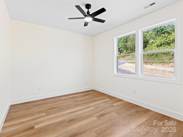169 Vineyard Village Dr S Unit 4, Old Fort, NC 28762 - empty room with light wood-style floors and a ceiling fan