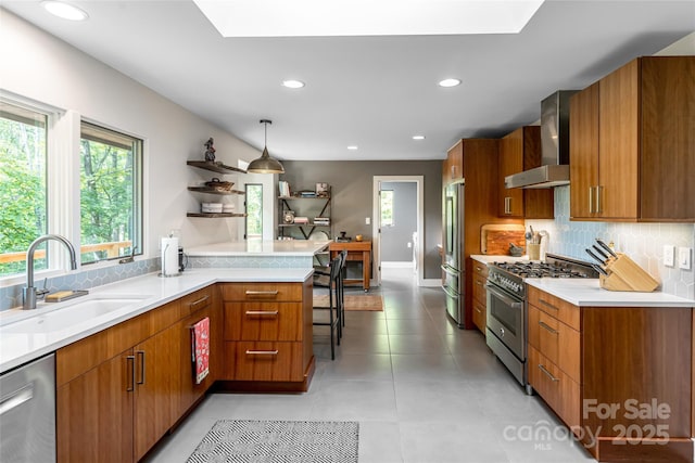 12 Beech Tree Ln, Asheville, NC 28804 - kitchen with stainless steel appliances, wall chimney range hood, modern cabinets, brown cabinetry, and decorative backsplash