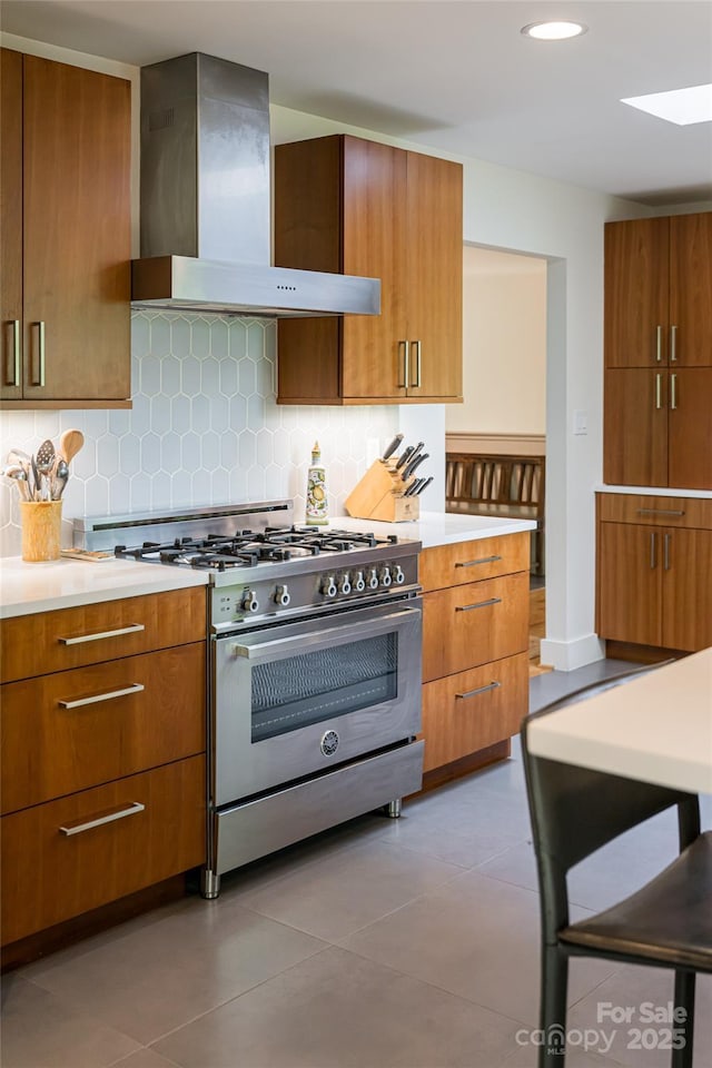 12 Beech Tree Ln, Asheville, NC 28804 - kitchen featuring wall chimney range hood, high end stove, light countertops, tasteful backsplash, and recessed lighting
