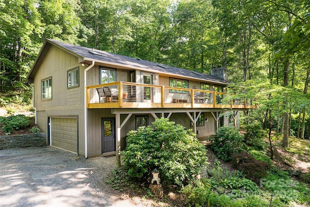 12 Beech Tree Ln, Asheville, NC 28804 - view of front of property with driveway, a wooden deck, a garage, and a chimney