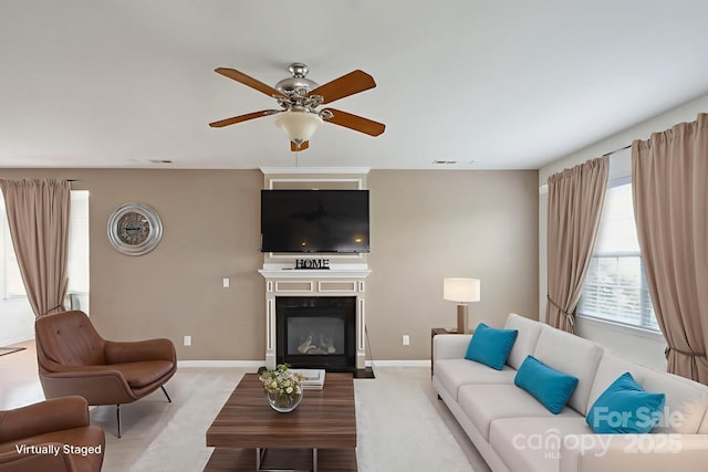 8915 Merrie Rose Ave, Charlotte, NC 28213 - living room featuring a glass covered fireplace, carpet floors, and a ceiling fan