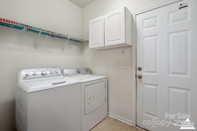 8915 Merrie Rose Ave, Charlotte, NC 28213 - laundry area featuring cabinet space, washer and clothes dryer, and light tile patterned flooring