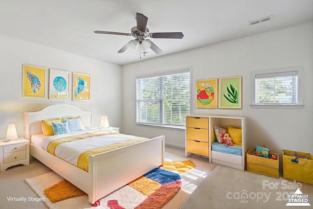 8915 Merrie Rose Ave, Charlotte, NC 28213 - bedroom with light colored carpet and ceiling fan