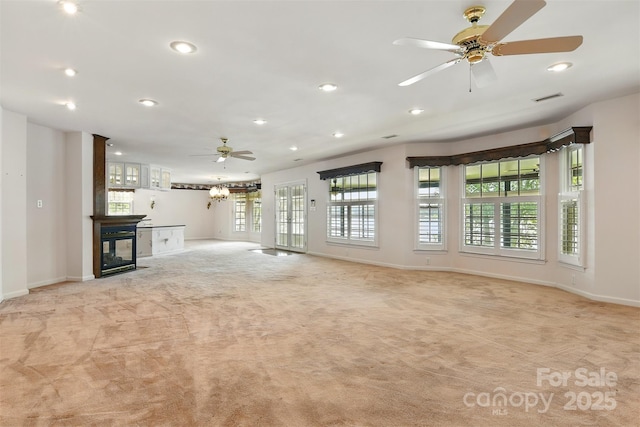 441 Wildlife Club Ln, Taylorsville, NC 28681 - unfurnished living room featuring light carpet, baseboards, recessed lighting, a ceiling fan, and a multi sided fireplace