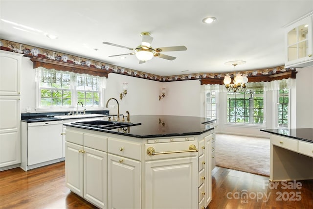 441 Wildlife Club Ln, Taylorsville, NC 28681 - kitchen with dishwasher, a sink, dark countertops, a chandelier, and a center island