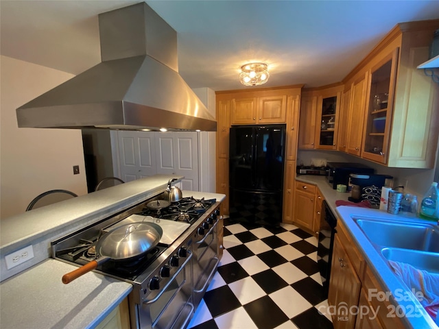 5570 George Henry Dr, Hickory, NC 28602 - kitchen featuring freestanding refrigerator, wall chimney range hood, light floors, and light countertops