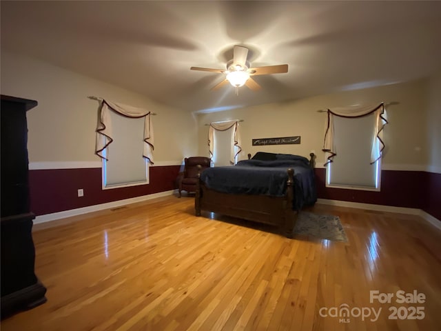5570 George Henry Dr, Hickory, NC 28602 - bedroom featuring wood finished floors and ceiling fan