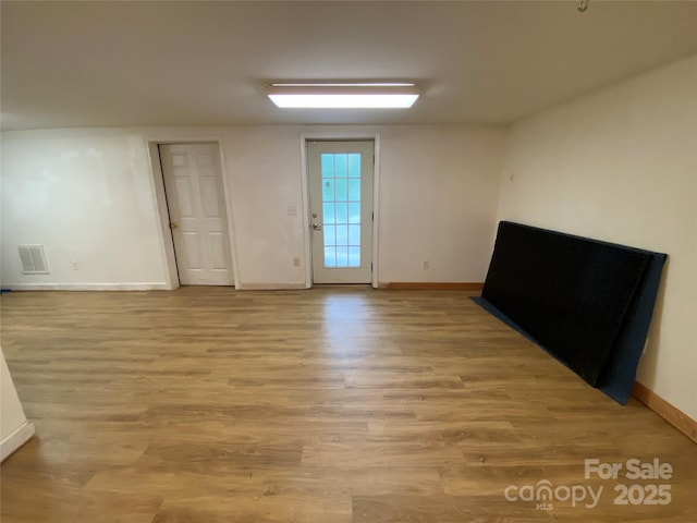 5570 George Henry Dr, Hickory, NC 28602 - spare room with baseboards and light wood-type flooring