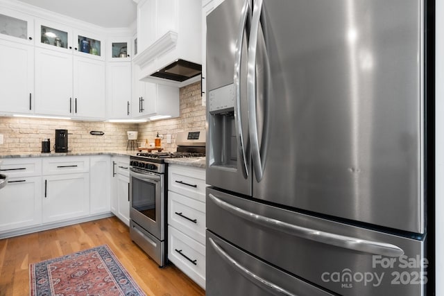 3622 46th Ave NE, Hickory, NC 28601 - kitchen featuring stainless steel appliances, tasteful backsplash, glass insert cabinets, white cabinets, and light stone countertops