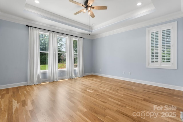 3622 46th Ave NE, Hickory, NC 28601 - empty room featuring a raised ceiling, crown molding, light wood-style floors, a ceiling fan, and recessed lighting