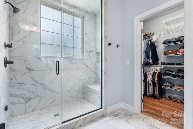 3622 46th Ave NE, Hickory, NC 28601 - bathroom featuring a marble finish shower, marble finish floors, and a walk in closet
