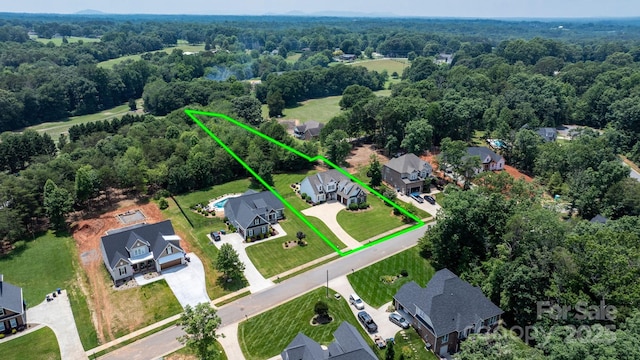 3622 46th Ave NE, Hickory, NC 28601 - aerial view of residential area featuring property parcel outlined and a forest
